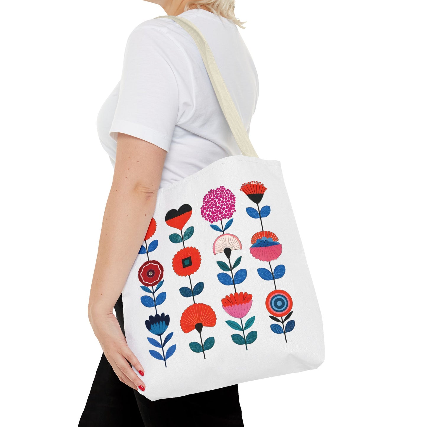 Woman holding a Floral Pattern Tote Bag with a vibrant flower design, exemplifying style and practicality for everyday use.