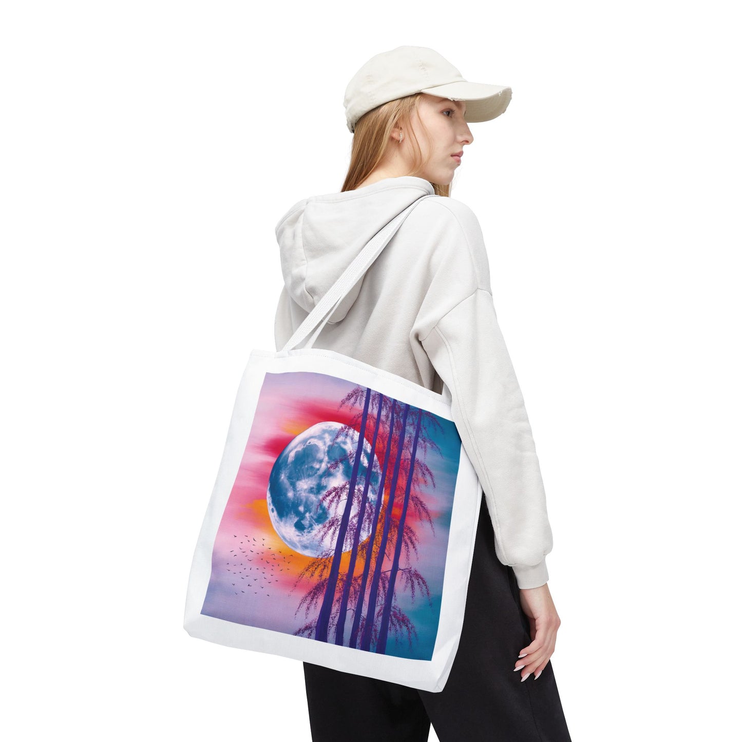 Moonlit Landscape Tote Bag: A vibrant abstract scene of a full moon with silhouetted trees against a fiery sunset sky, embodying artistic celestial themes, designed for durability and everyday use.