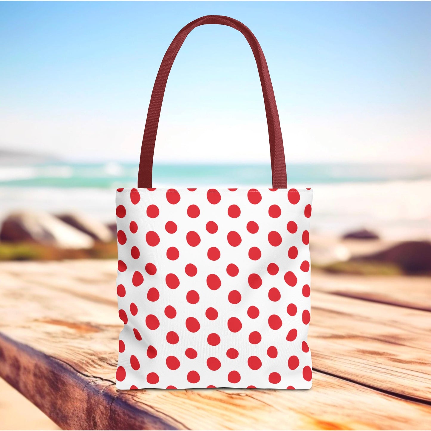 Red Polka Dots Tote Bag with a vibrant design, featuring red and white polka dots. Ideal for everyday use, this bag from FireBrook Designs combines style and practicality with durable construction and reinforced handles.