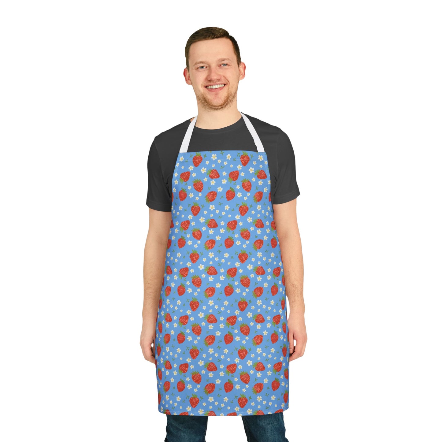 Man smiling while wearing the Apron, Strawberry 5-Color Straps, showcasing its vibrant strawberry design and adjustable fit, ideal for cooking and crafting, from FireBrook Designs' uplifting and stylish collection.
