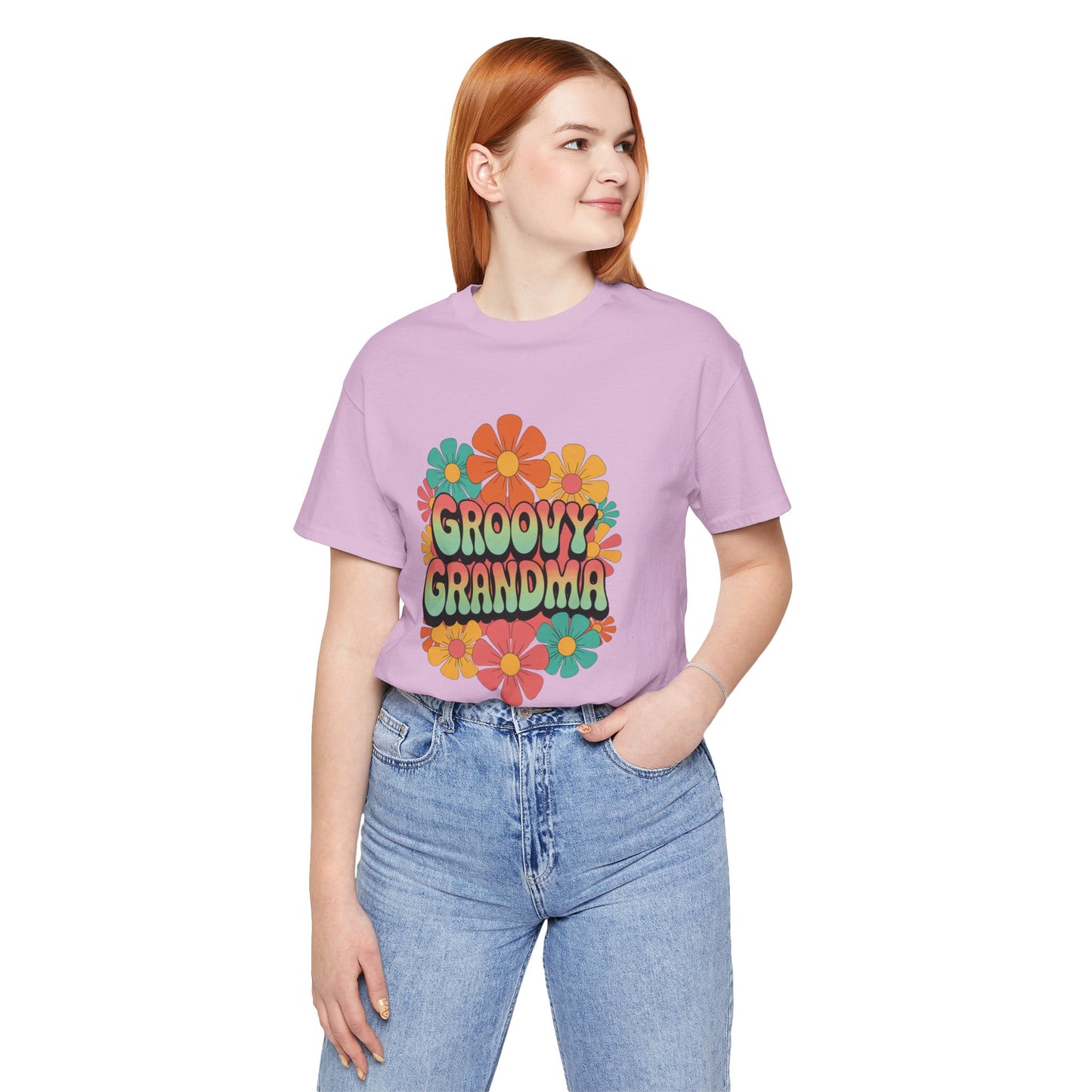 Groovy Grandma for Mother's Day Bella+Canvas Unisex T-Shirt featuring a vibrant flower design, worn by a woman in casual jeans, epitomizing retro style and comfort from FireBrook Essentials.