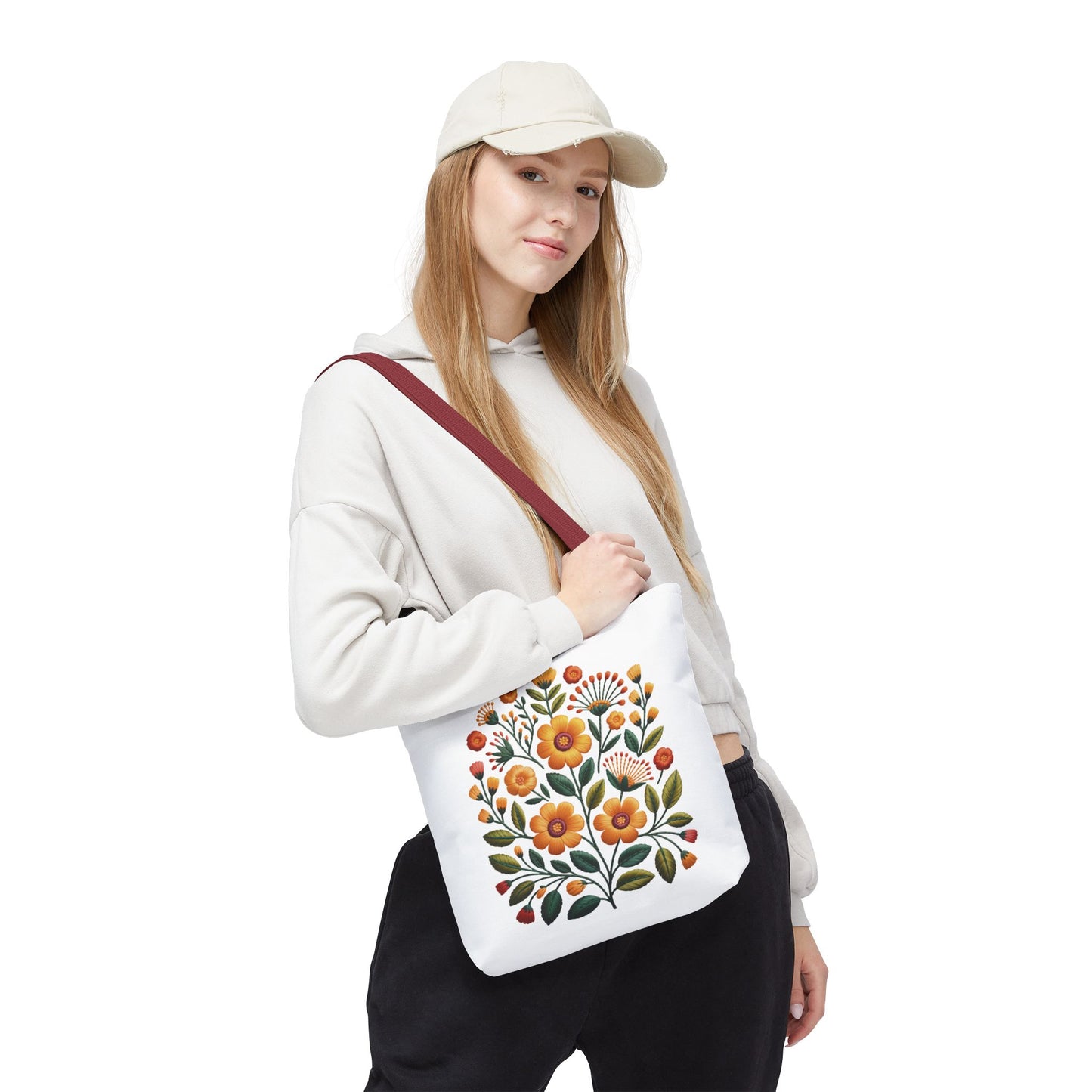 Folk Art Floral Faux Embroidery Style Tote Bag features warm yellow and earth-toned floral designs with olive green leaves, embodying a relaxed, artistic vibe ideal for daily use by nature lovers and artists.