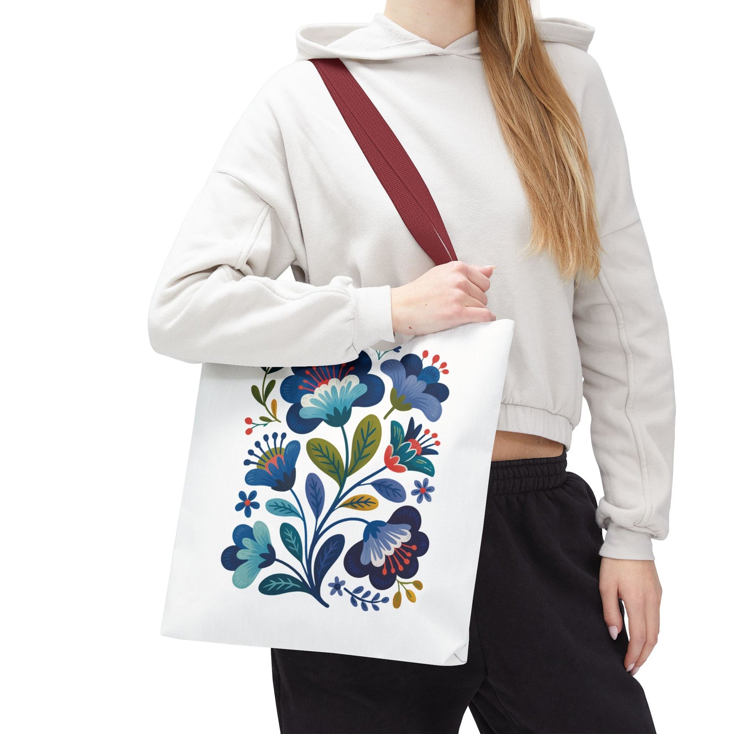 Vintage Folk Art Design Blue Floral Tote Bag featuring charming floral patterns, perfect for both everyday use and special occasions. Durable polyester body with reinforced handles, offering style and practicality in multiple sizes.