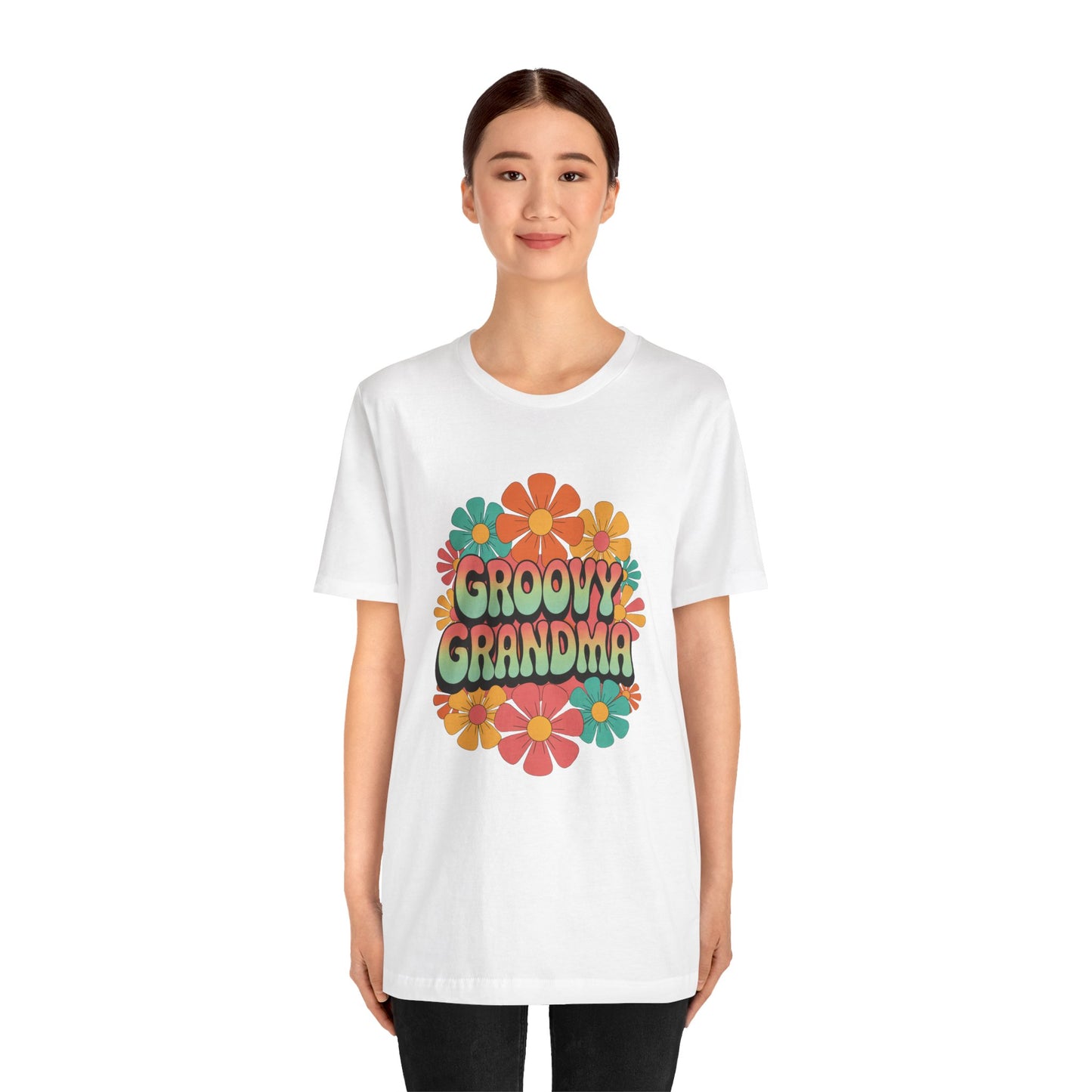Groovy Grandma for Mother's Day Bella+Canvas Unisex T-Shirt featuring a colorful flower design, worn by a woman, embodying a retro vibe perfect for vintage style lovers.
