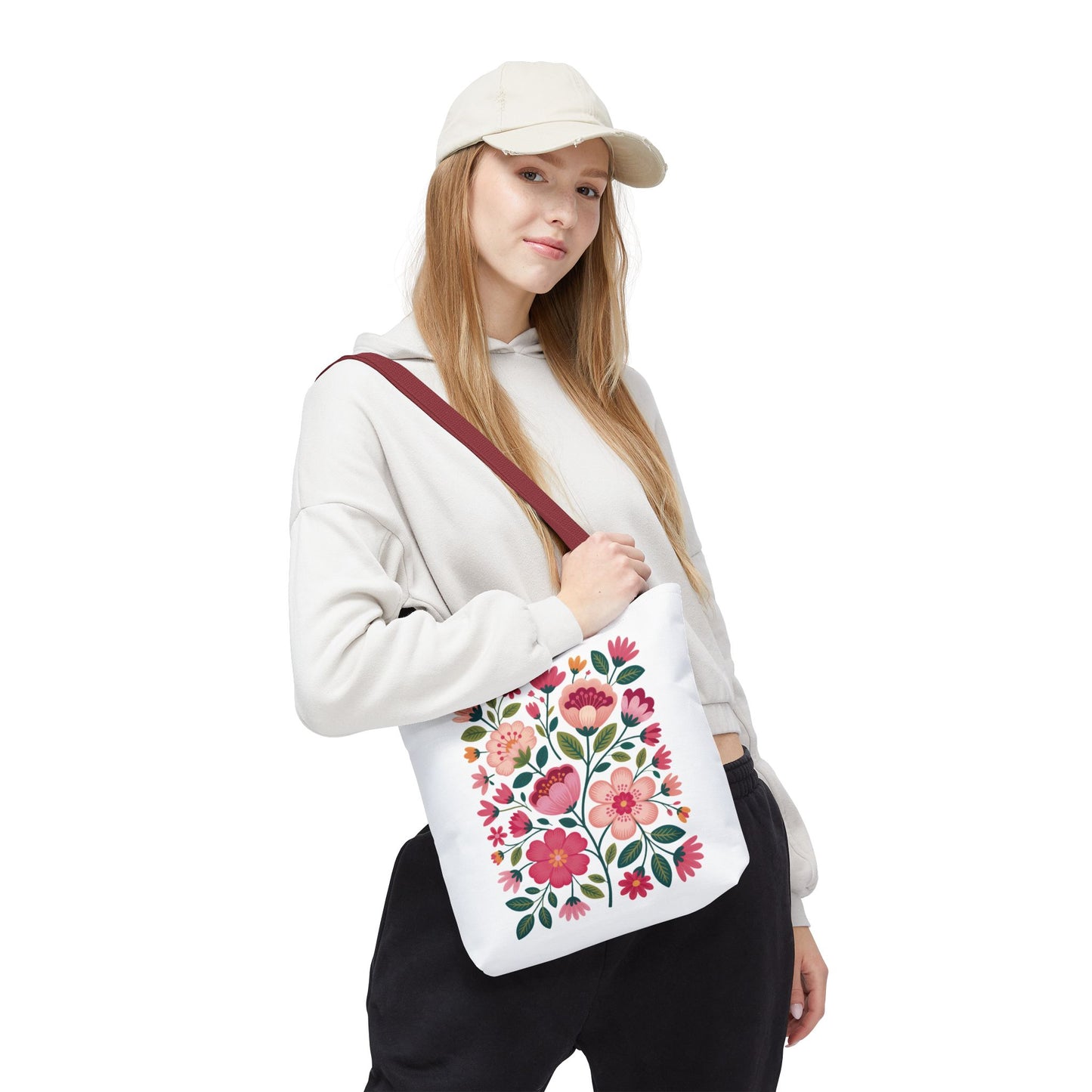 Pink Floral Folk-Art Style Tote Bag featuring vibrant pink flowers and dusty green leaves in a lively organic design, ideal for carrying essentials and adding a touch of joy to any outing.