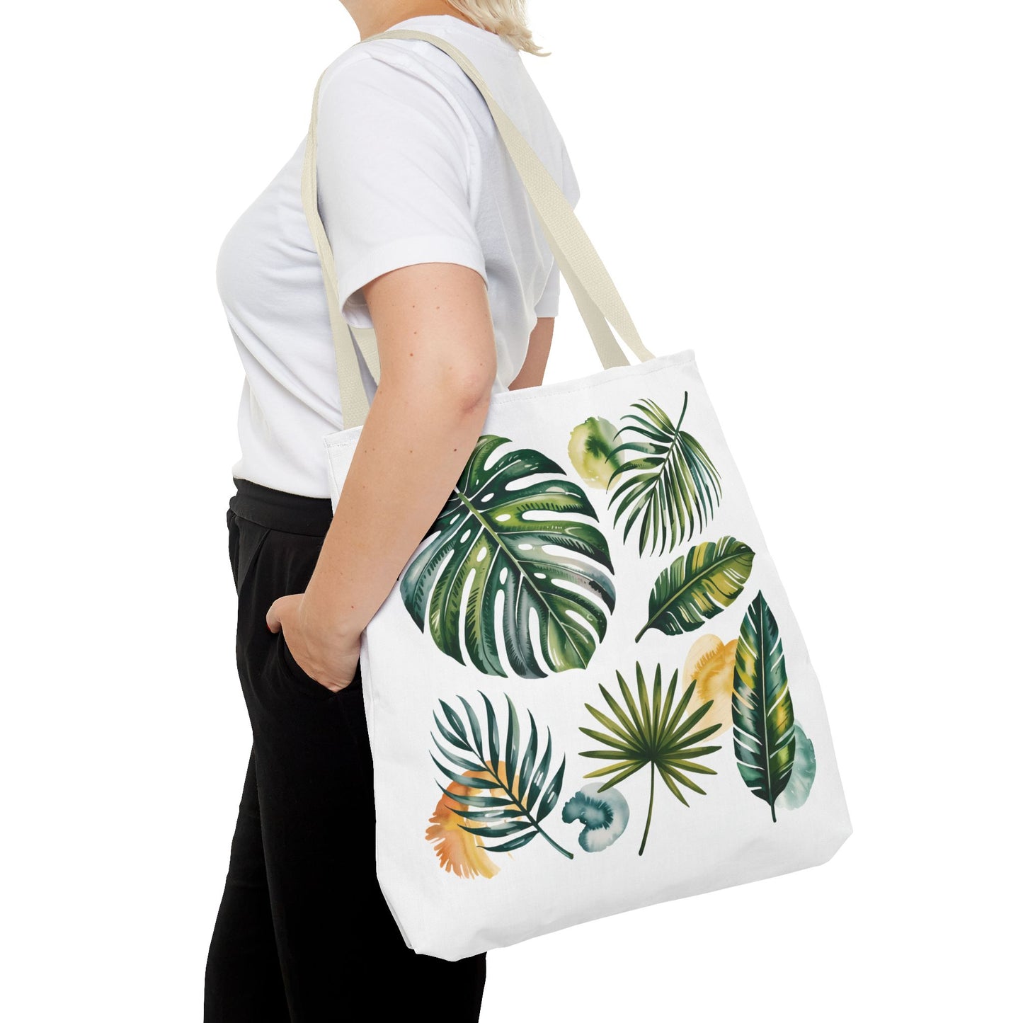 The Tropical Leaves Tote Bag features vibrant leaf patterns, showcasing a fresh, summery style. Designed for durability and spaciousness, it embodies FireBrook Designs' commitment to stylish, joyful, and practical fashion accessories.