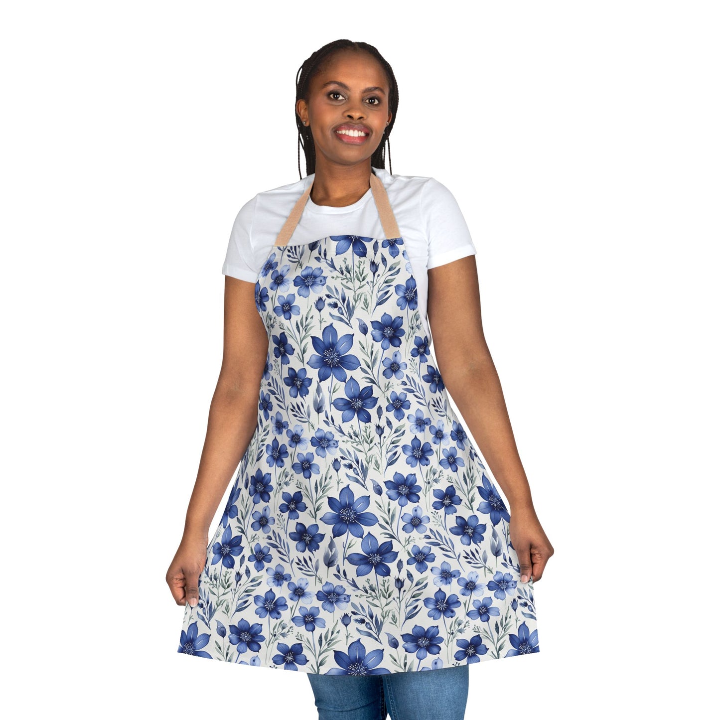 Apron, Blue Wildflower Pattern: A close-up of a smiling woman wearing a hand-painted indigo blue apron with a soft watercolor wildflower design, ideal for artistic and culinary enthusiasts.