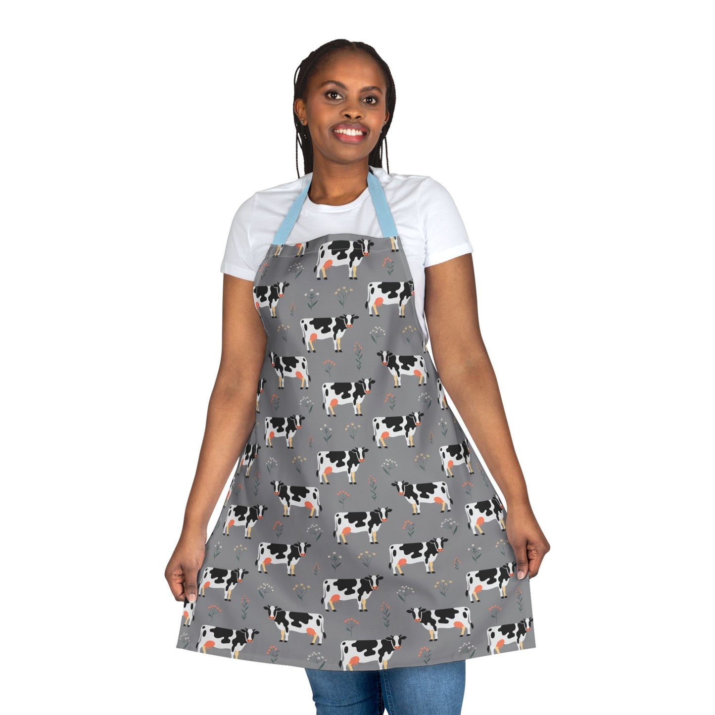 Apron Dairy Cows Pattern: Close-up of a woman wearing a cow-patterned apron, embodying a farm-inspired vibe. Ideal for cooking, crafting, or gardening, designed for comfort and style by FireBrook Designs.