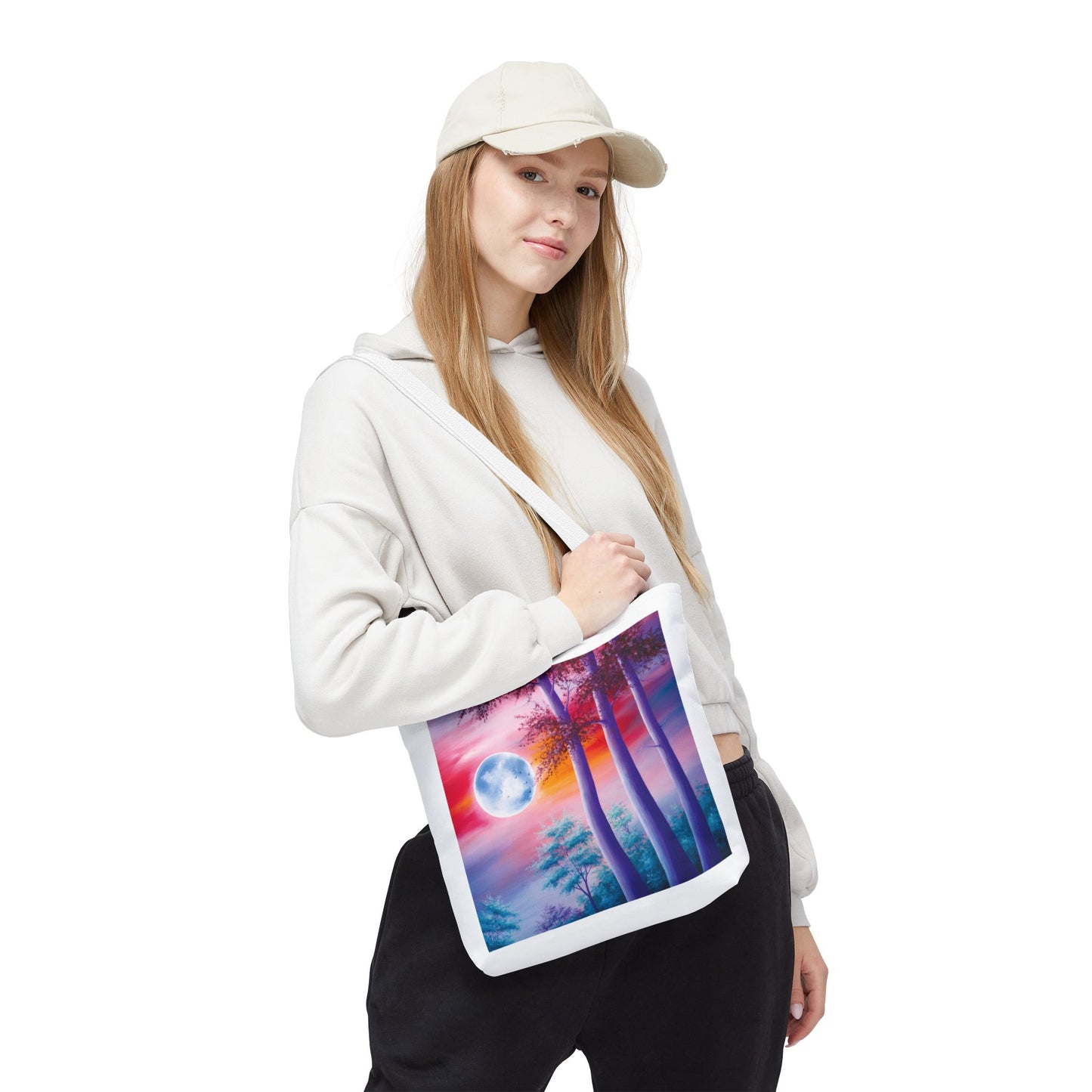 Moonlit Forest Tote Bag showcasing an abstract full moon and towering trees against a sunset sky, embodying mystical art. Ideal for everyday use, crafted from durable polyester with reinforced handles.