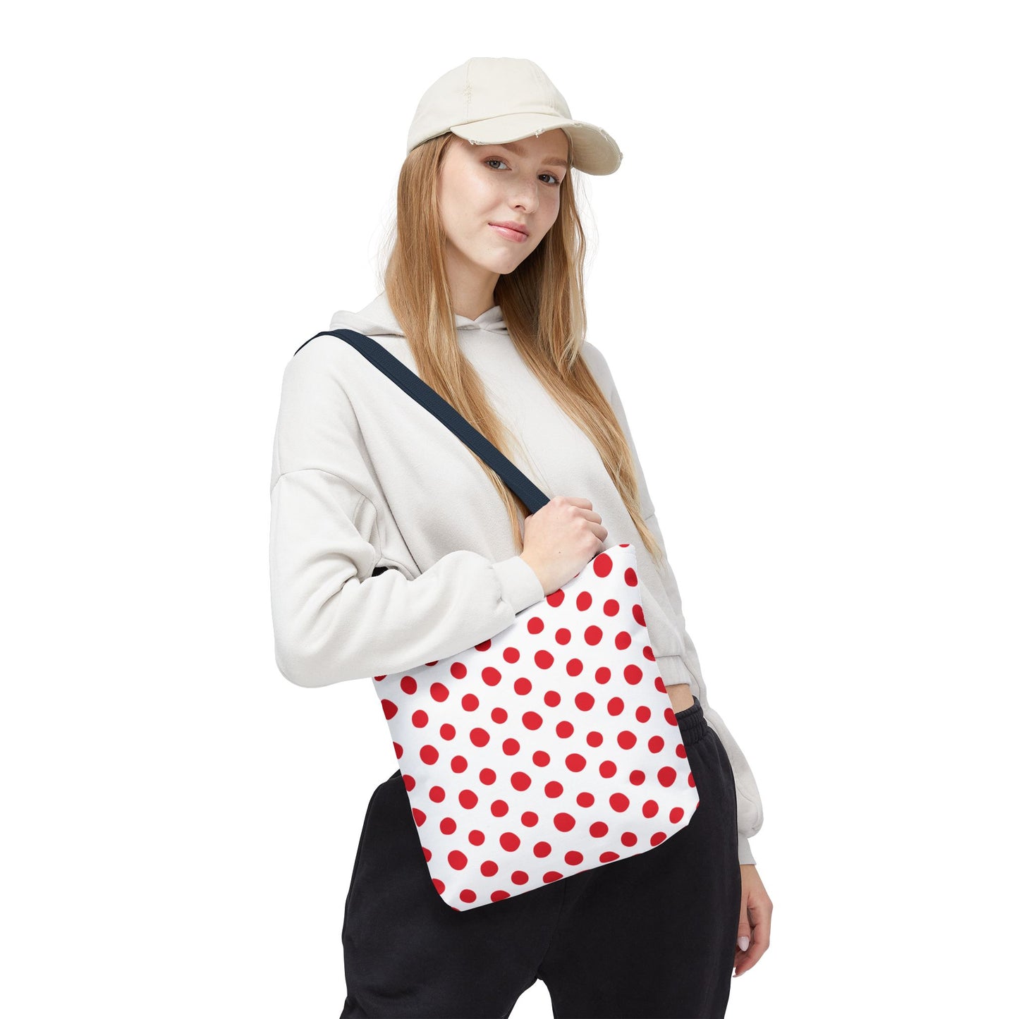 Red Polka Dots Tote Bag: A close-up of a woman holding a fashion-forward tote with vibrant red polka dots, perfect for everyday use and festive occasions, reflecting FireBrook Designs' joyful and stylish essence.