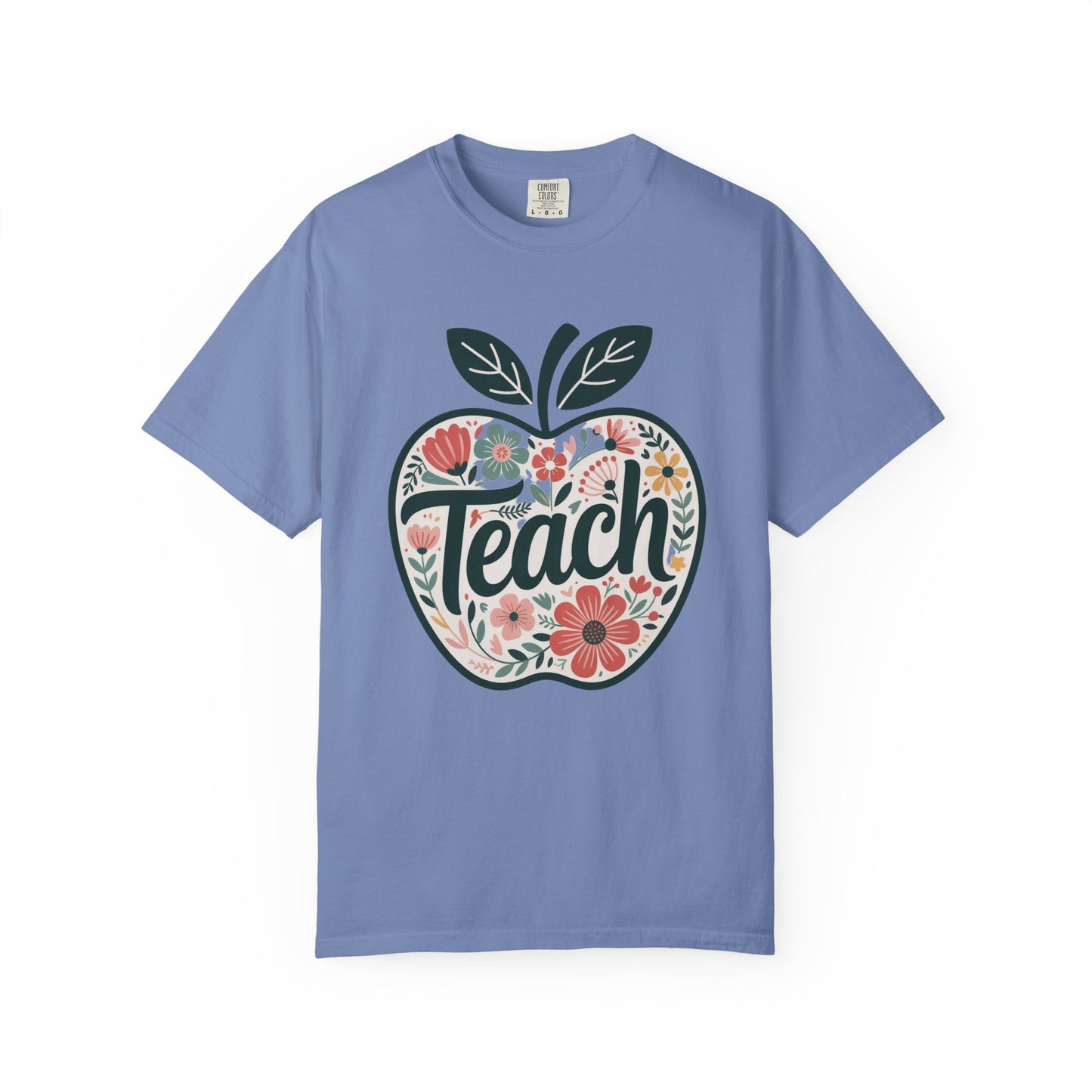 Floral Apple TEACH T-shirt showcases a large apple with pastel floral illustrations and TEACH in bold script, embodying a whimsical, artistic style perfect for educators and nature lovers.