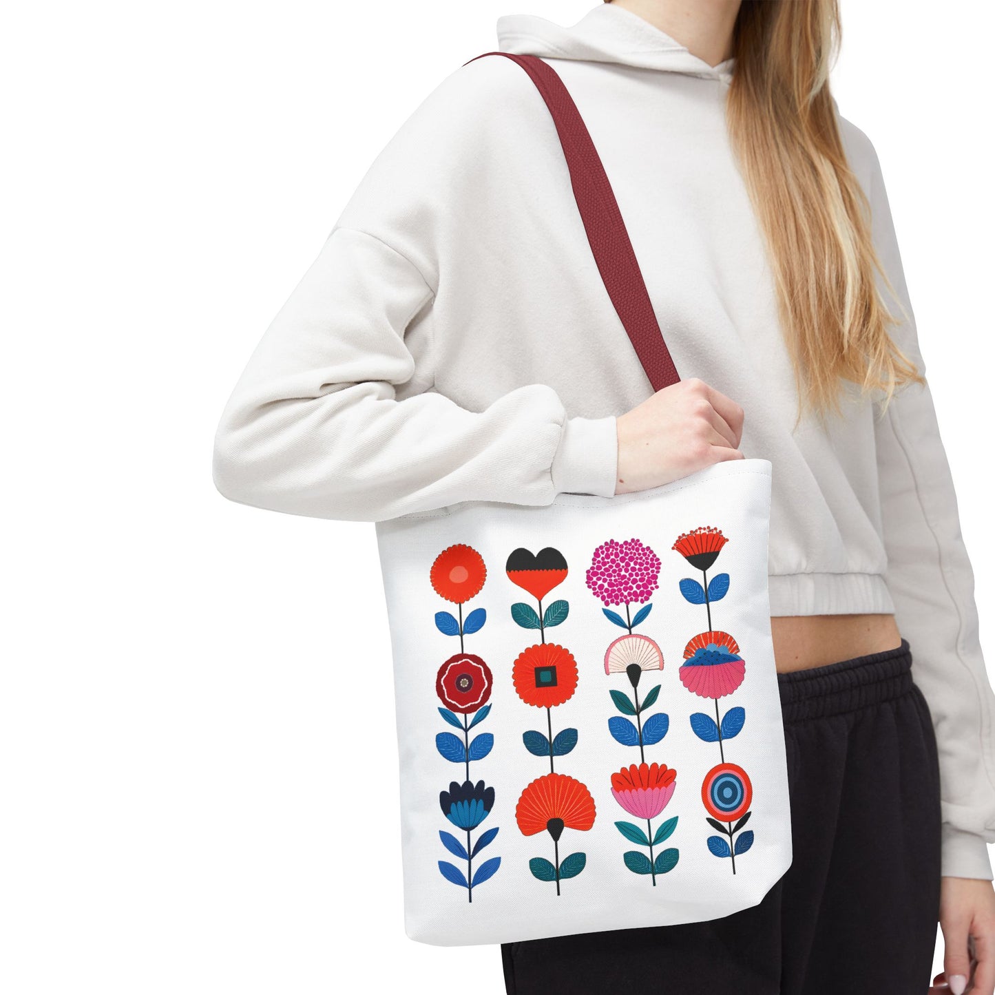 Woman holding Floral Pattern Tote Bag with colorful flower design, perfect for stylish, practical use. Ideal for carrying essentials with ease and charm.