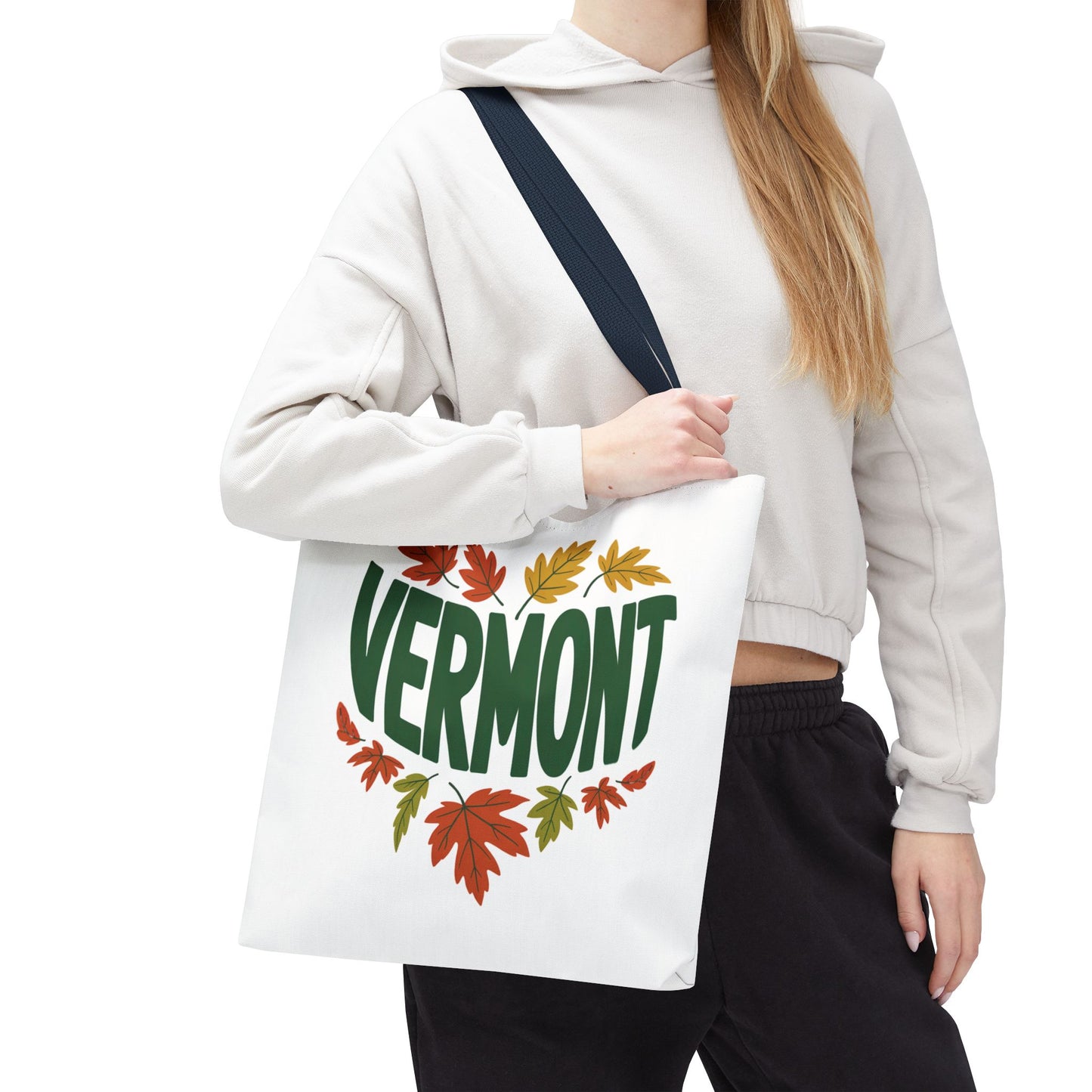 Close-up of a hand holding the Vermont Tote Bag, showcasing its durable polyester fabric and reinforced stitching, perfect for daily essentials. The tote exemplifies FireBrook Essentials' commitment to stylish, functional design.