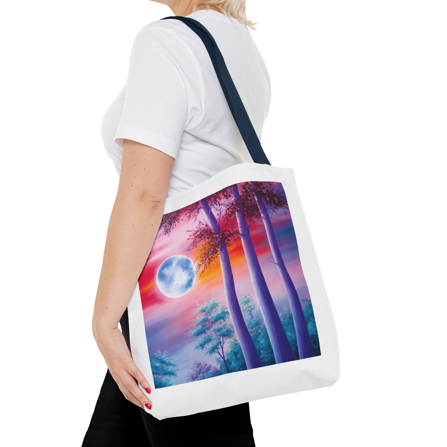 Moonlit Forest Tote Bag featuring an abstract full moon scene with towering trees against a dramatic sunset sky, embodying an ethereal vibe. Ideal for art lovers and nature-themed occasions.