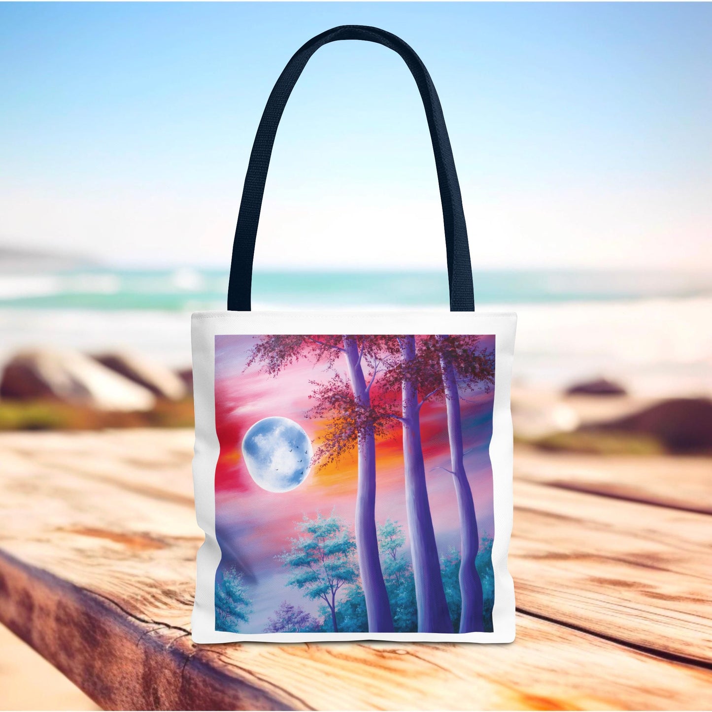 Moonlit Forest Tote Bag featuring a mystical full moon with towering trees against a sunset sky, designed for art lovers and nature enthusiasts. Durable polyester with reinforced handles, available in three sizes.