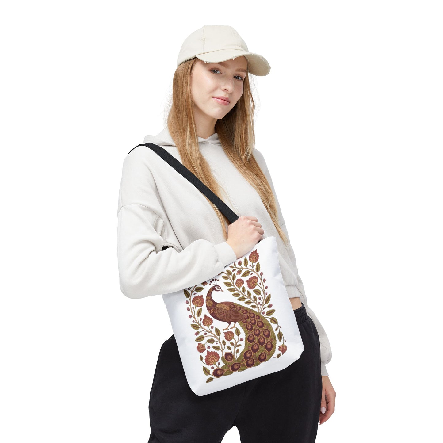 Peacock Tote Bag with Floral Vines and Paisley Motifs held by a woman, showcasing its elegant design with intricate patterns. A perfect blend of style and function for everyday use.