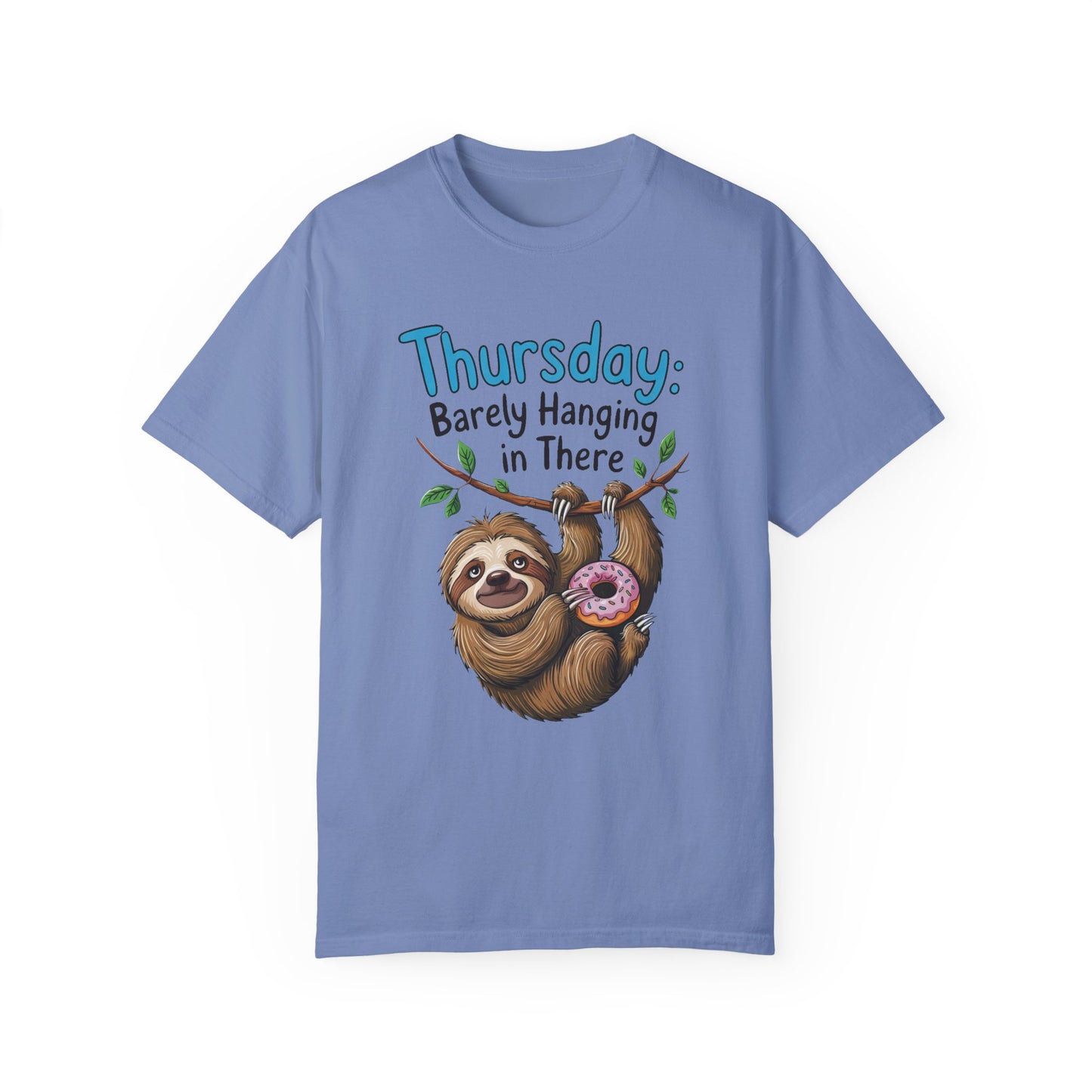 Thursday: Barely Hanging In There Sloth Graphic Comfort Colors Unisex T-Shirt featuring a cartoon sloth holding a donut, perfect for casual and relaxed moments. Ideal for sloth enthusiasts seeking comfort.