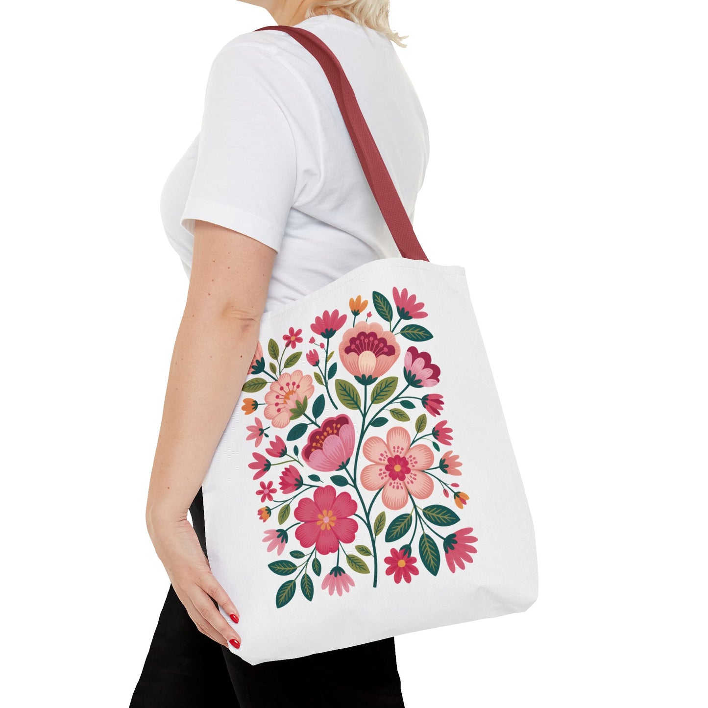 Pink Floral Folk-Art Style Tote Bag featuring vibrant floral designs in pink tones with dusty green leaves and navy accents. Ideal for carrying essentials, this tote embodies FireBrook Essentials' commitment to joyful, stylish living.