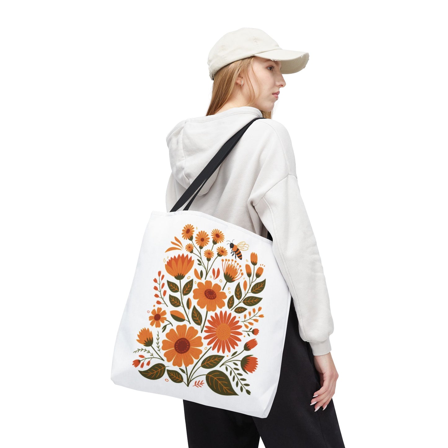 Folk Floral Tote Bag showcasing hand-drawn wildflowers, ideal for nature lovers. Crafted from durable polyester with reinforced handles and boxed corners, it's perfect for everyday use and joyful expression.