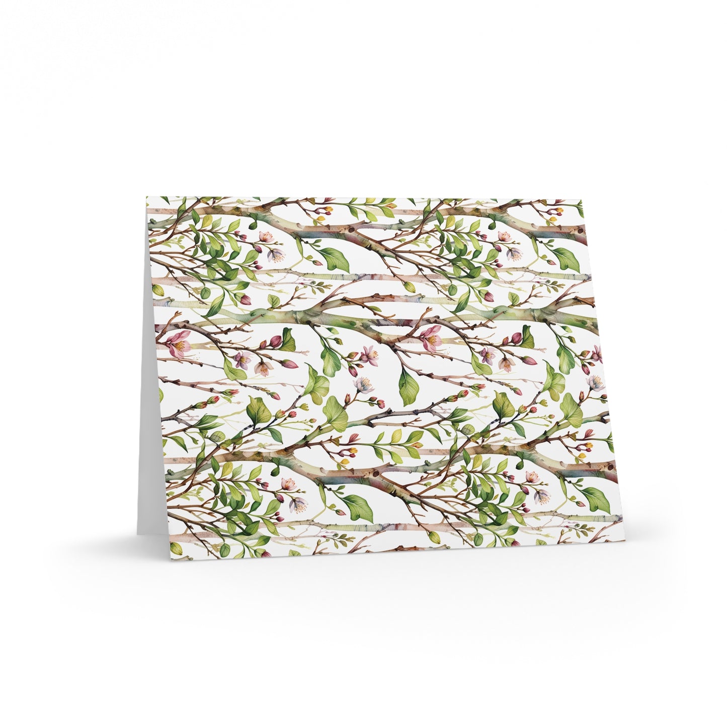 Greeting Cards — Pack of 8/16/24 featuring a delicate watercolor pattern of tree branches, green leaves, and pink blossoms on a matte-finish card, ideal for joyful, personal messages.