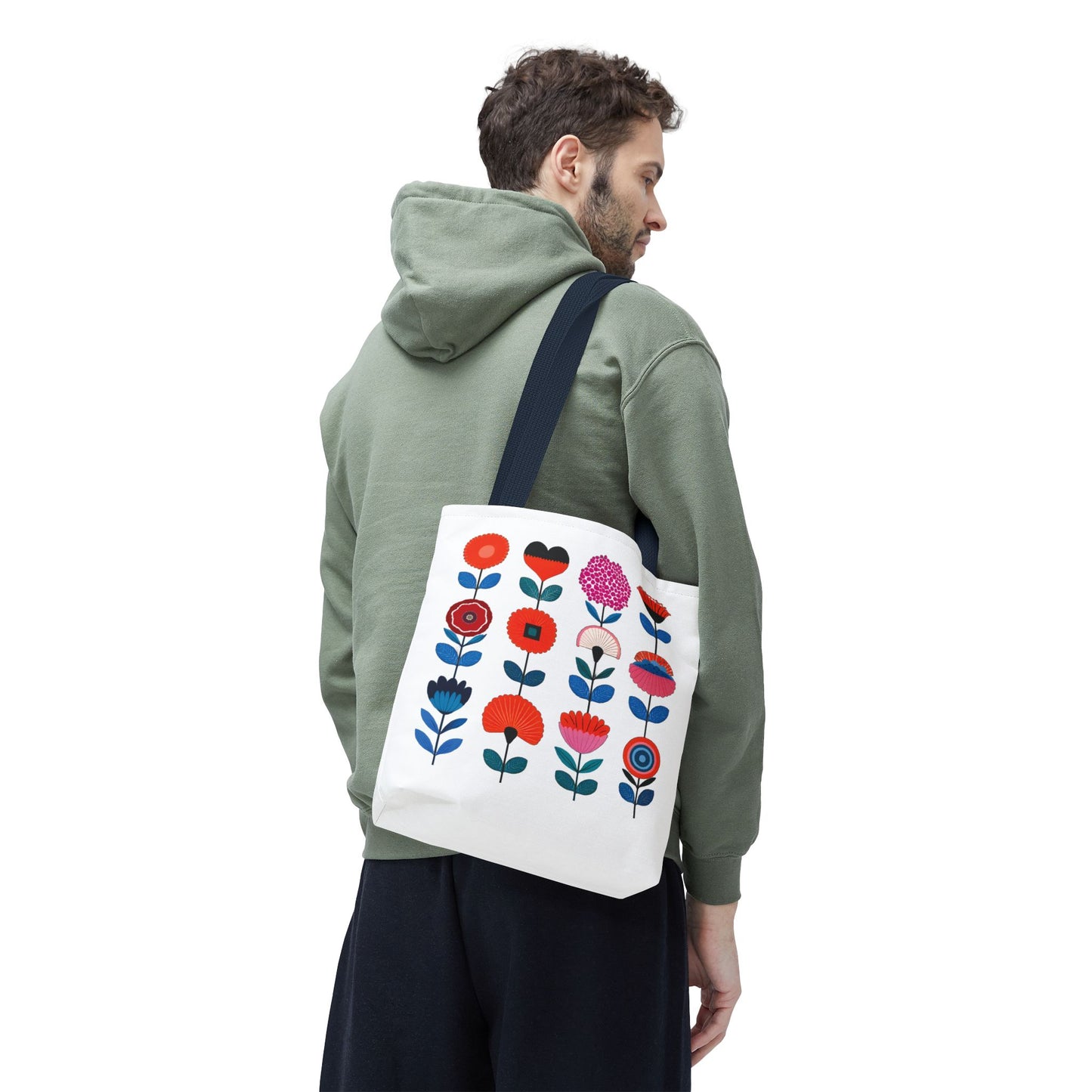 Floral Pattern Tote Bag held by a man in a green sweatshirt, showcasing its stylish floral design. Ideal for daily errands and outdoor adventures.