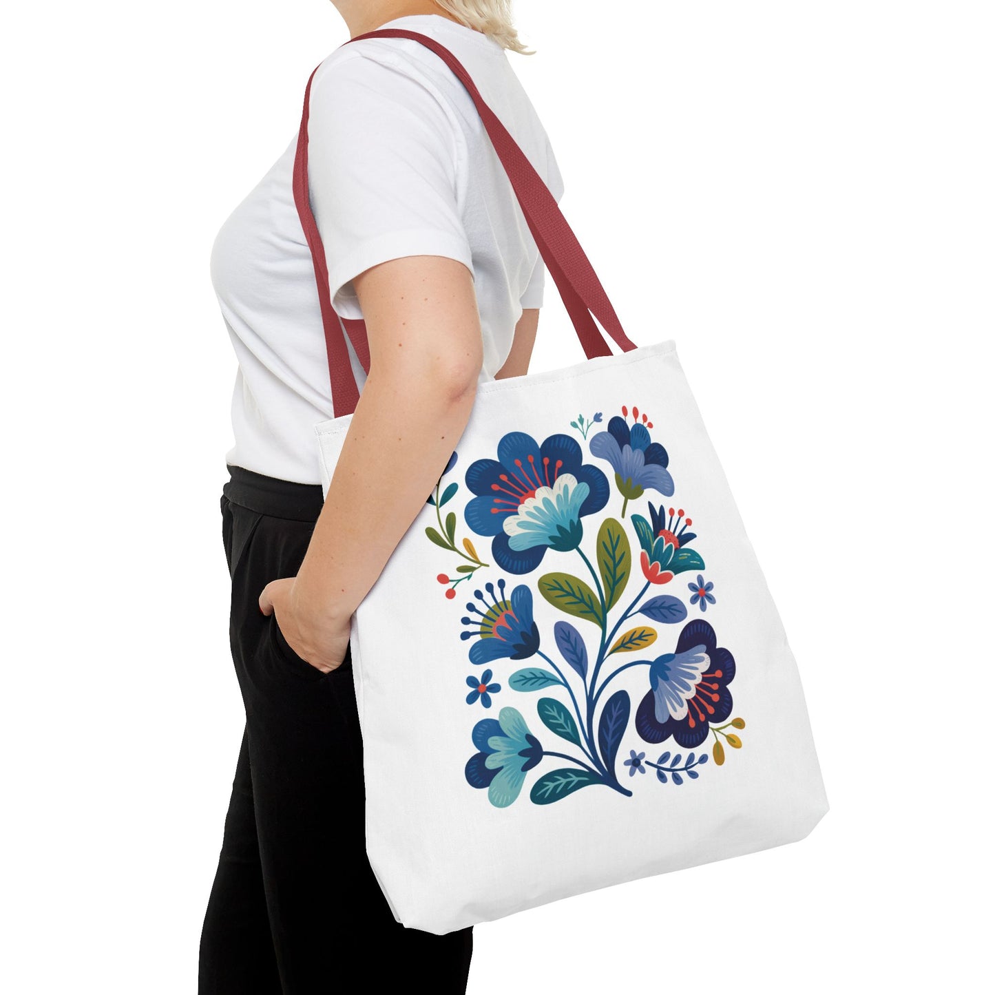 Vintage Folk Art Design Blue Floral Tote Bag with a charming, nostalgic vibe, featuring a durable 100% polyester body and reinforced handles, ideal for everyday use or special occasions. Available in multiple handle colors.