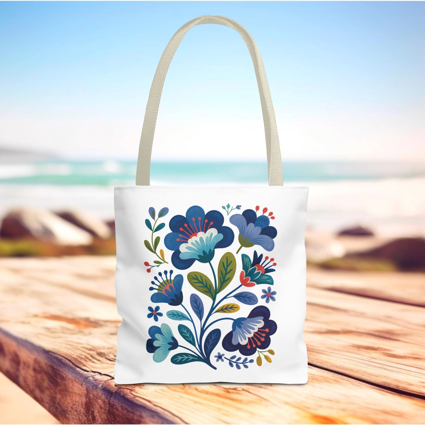 Vintage Folk Art Design Blue Floral Tote Bag showcasing an intricate blue floral pattern, ideal for daily use or special occasions. Durable polyester with reinforced handles, available in multiple sizes, embodies FireBrook Essentials' commitment to style and positivity.