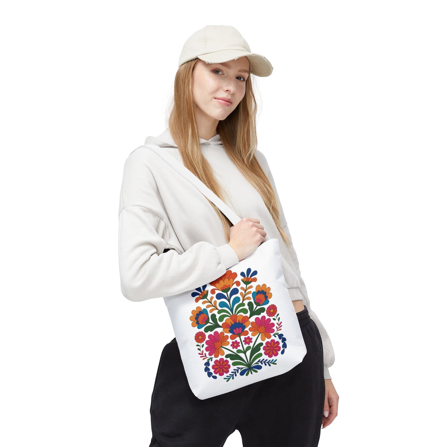Red Folk-Art Floral Tote Bag featuring lively, organic floral illustrations in red tones with soft blush, blue, green leaves, and accents. Ideal for carrying essentials, reflecting FireBrook Essentials' vibrant and uplifting design ethos.