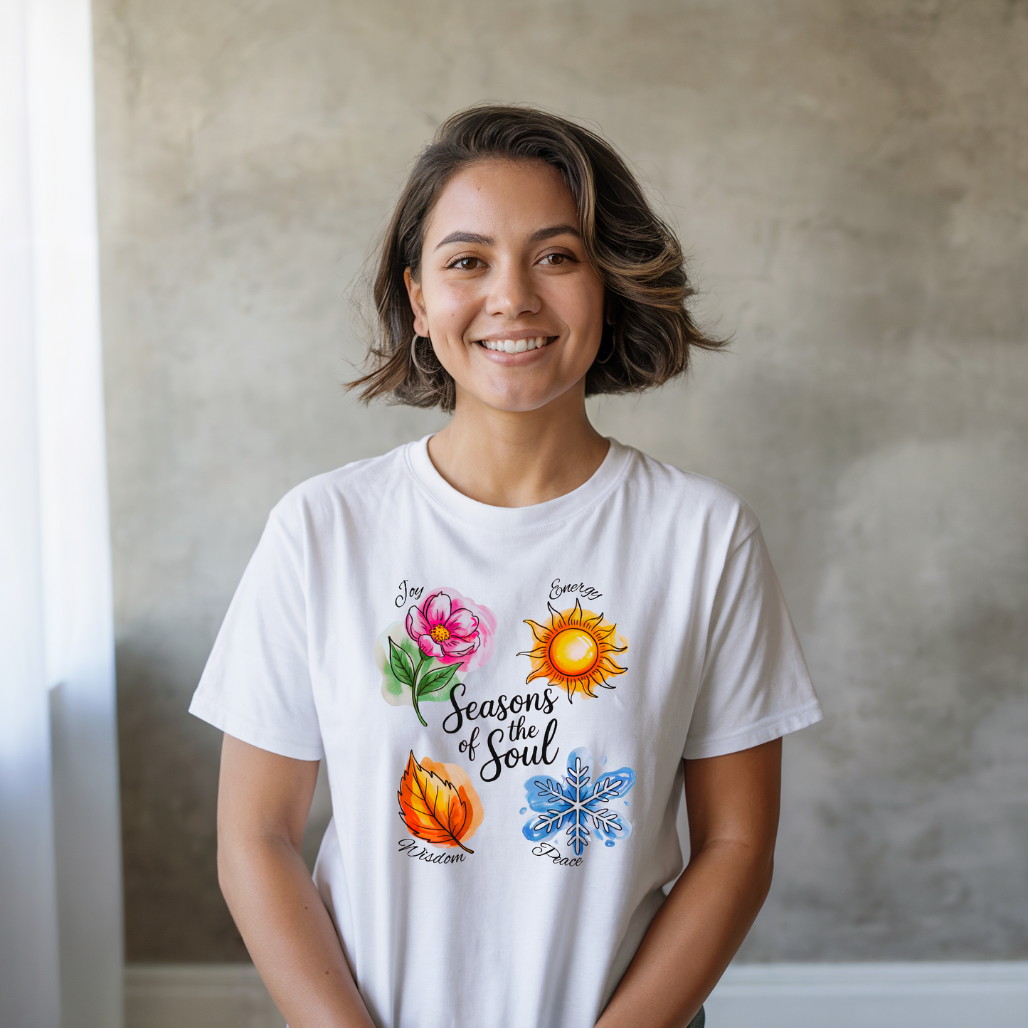 Seasons of the Soul: Joy, Energy, Wisdom & Peace T-Shirt showcased on a hanger, highlighting its soft jersey fabric and uplifting design, perfect for yoga, meditation, or spiritual celebrations.