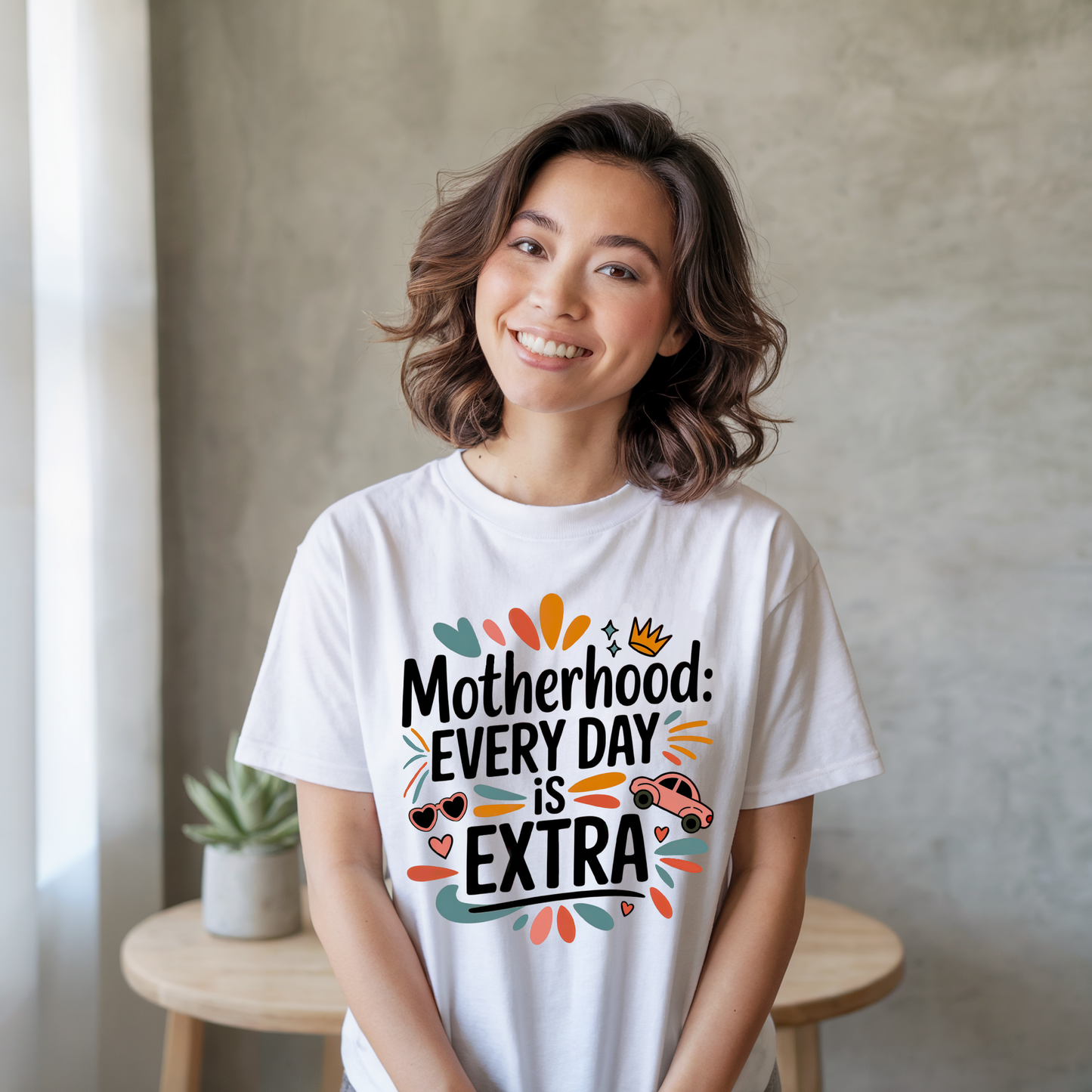 Motherhood: Every Day is Extra T-Shirt - A unisex jersey short sleeve tee, showcasing comfort and style for moms, perfect for casual or semi-formal wear, made by Bella+Canvas.