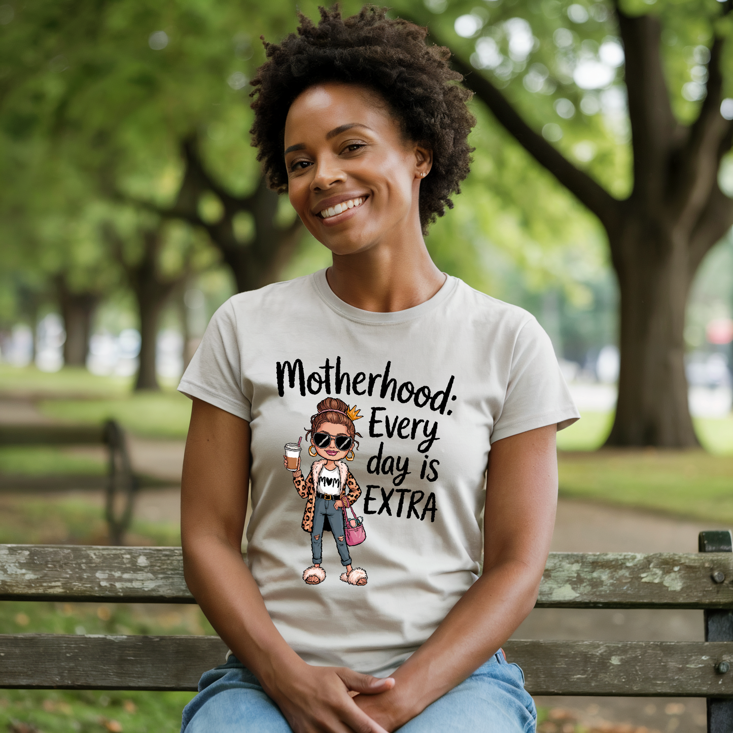 Motherhood: Every Day is Extra T-Shirt; a comfortable unisex tee with a heartfelt message, featuring durable double-needle stitching and soft garment-dyed fabric, perfect for celebrating motherhood daily.