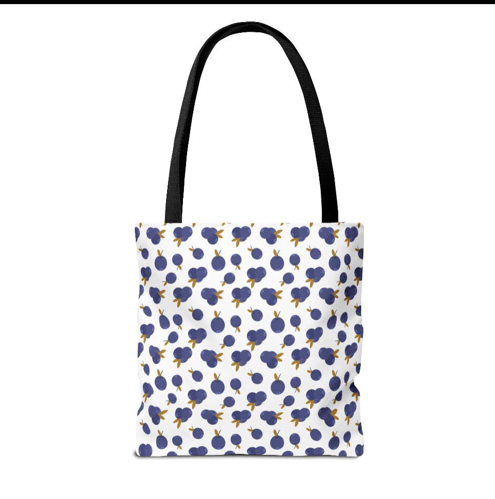 Blueberry Tote Bag by Firebook Designs features a charming blueberry pattern with black handles, offering style and practicality for everyday use. Perfect for casual outings and grocery shopping.