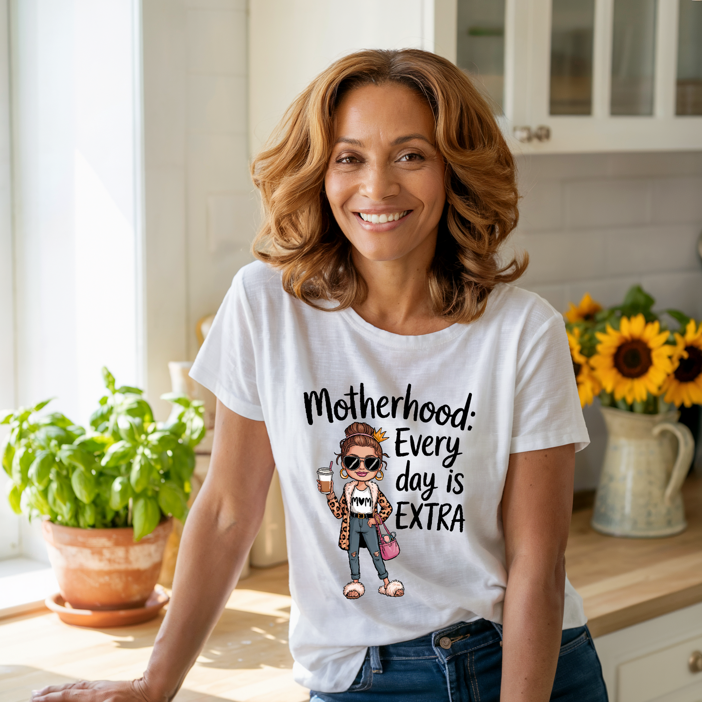 Motherhood: Every Day is Extra T-Shirt, featuring a soft, garment-dyed fabric with the uplifting message, perfect for celebrating motherhood. Designed for comfort and durability with double-needle stitching. Ideal for joyful gifting.