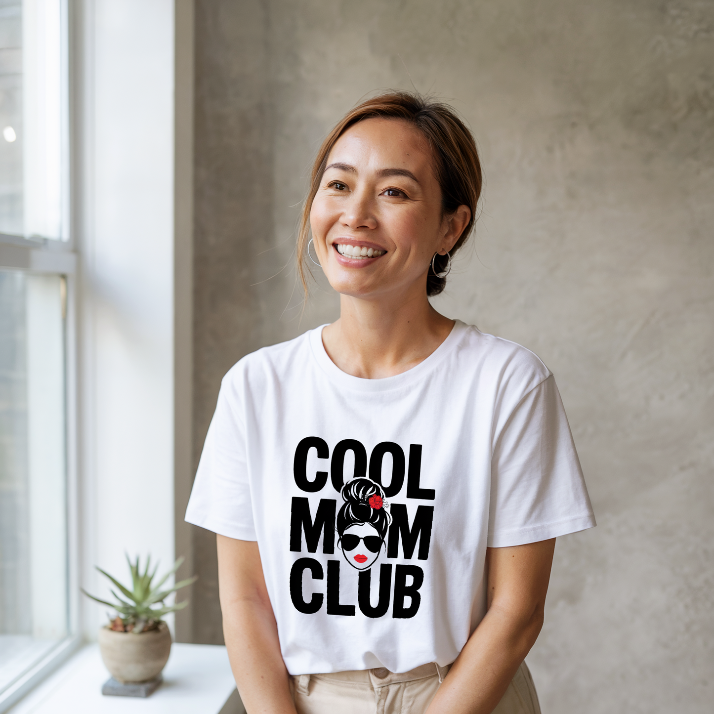 Cool Mom Club T-shirt featuring a relaxed fit and classic crew neckline. Made from durable, ethically sourced US cotton, perfect for stylish moms seeking comfort and versatility in their wardrobe.