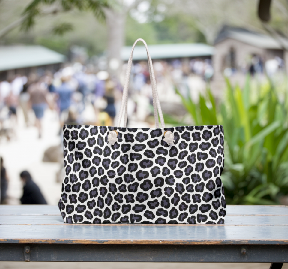 Weekender Bag - Gray Cheetah Print Duffle Bag: Close-up of a stylish, durable bag featuring a bold cheetah print design with sturdy rope handles, ideal for fashion-forward travel.
