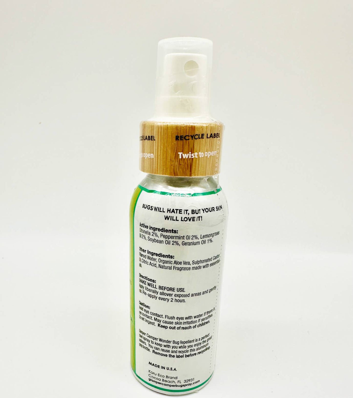 Glamper Camper Wonder Bug Repellent in a sleek, reusable aluminum spray bottle with bamboo-look cap, featuring natural ingredients like citronella and peppermint oils. Ideal for outdoor use, embodying FireBrook Essentials' commitment to joy and ease.