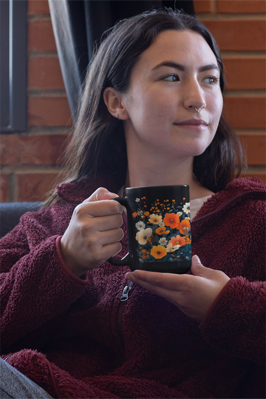 Vibrant Floral Mug (11oz, 15oz) held by a smiling woman, showcasing a whimsical zinnia and wildflowers design. Perfect for cozy beverages, aligning with FireBrook Designs' uplifting, nature-inspired creations.