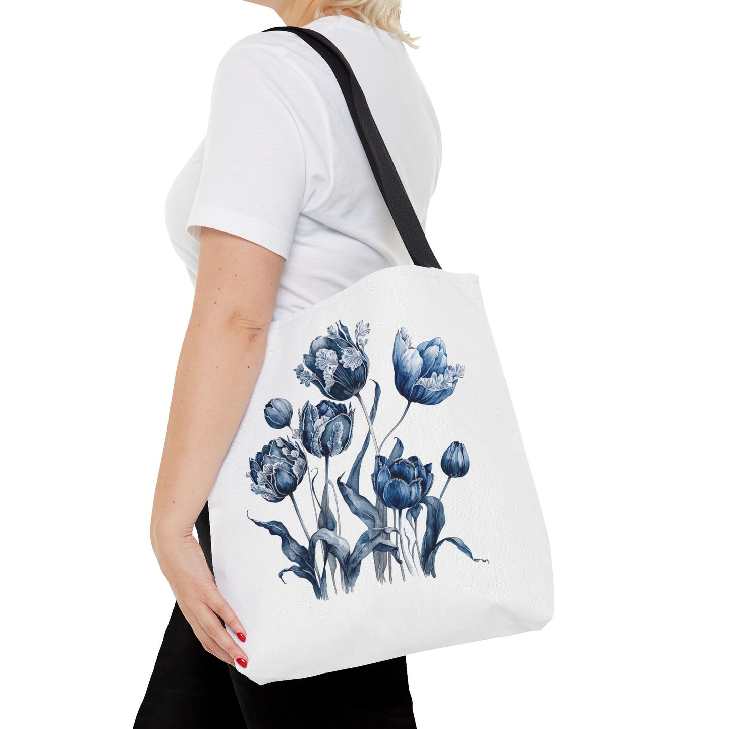 Flowers in Blue Hue Watercolor Tote Bag: A woman carries this stylish, durable tote, featuring blue floral designs, perfect for daily errands and outdoor adventures.