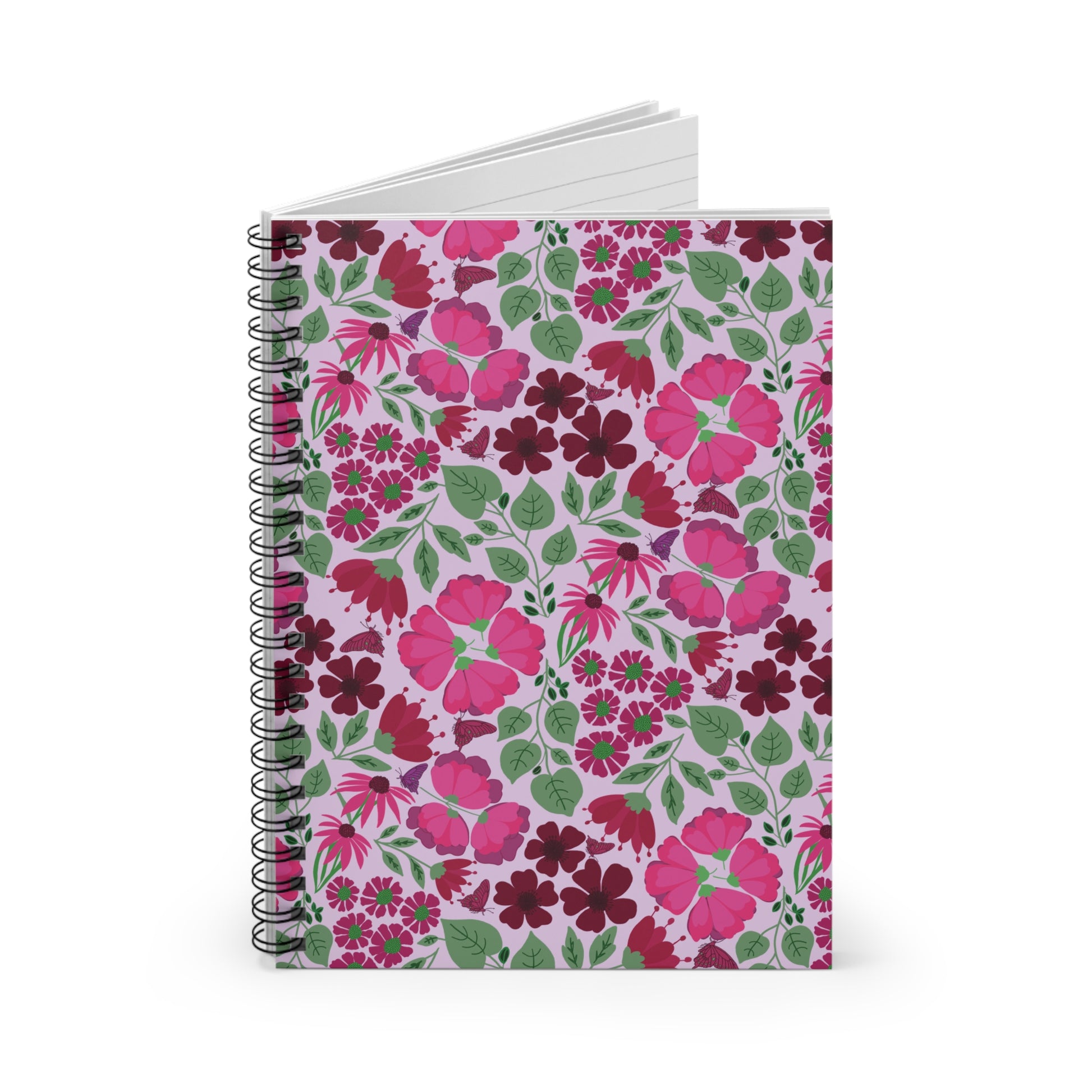 Floral Spiral Notebook with a lavender cover featuring vibrant magenta blossoms, burgundy and pink flowers, green leaves, and purple butterflies, bound with a black spiral. Ideal for creative, on-the-go note-taking.