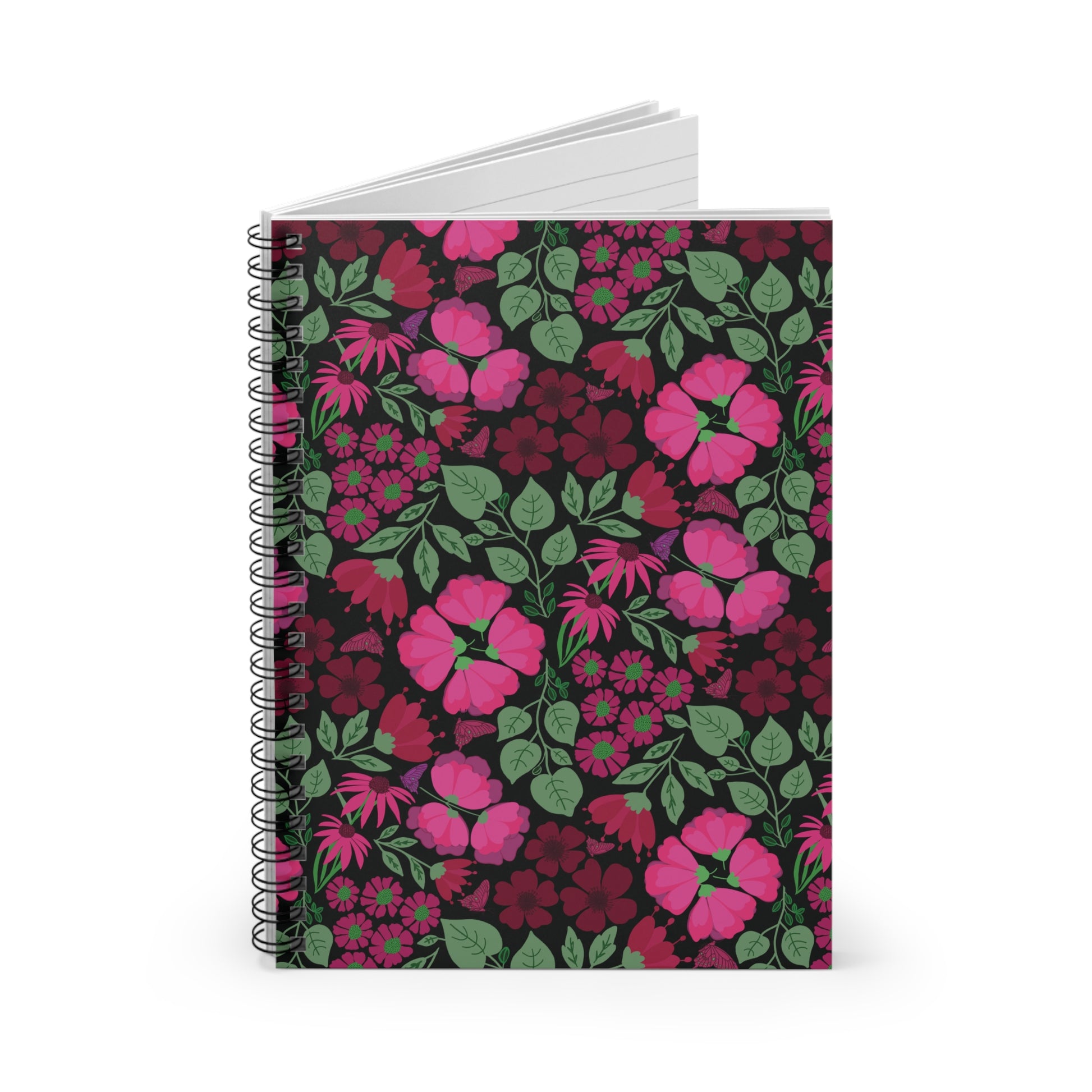 Floral Spiral Notebook stands upright, featuring pink and magenta blossoms on a dark cover. Its blank, lined pages fan out, ideal for organizing thoughts and inspiring creativity for any occasion.
