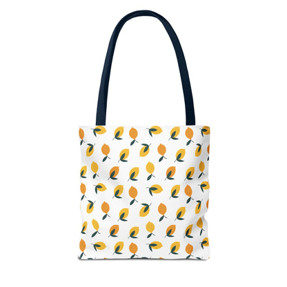 Lemon Drop Toss Tote Bag with navy handles, featuring a vibrant, stylized lemon pattern, ideal for summer outings and adding a cheerful touch to your style.