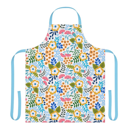 Floral Apron from FireBrook Designs features a vibrant multicolored floral pattern on white. It has sky-blue neck and waist ties, offering full coverage and comfort with its 100% polyester canvas material.