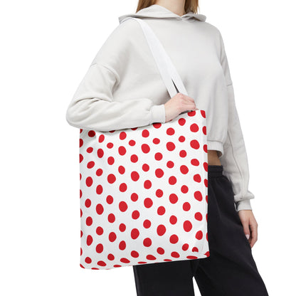 Red Polka Dots Tote Bag held by a woman, featuring a playful red and white polka dot pattern. This versatile bag from FireBrook Designs is perfect for errands or beach trips, combining style and functionality.