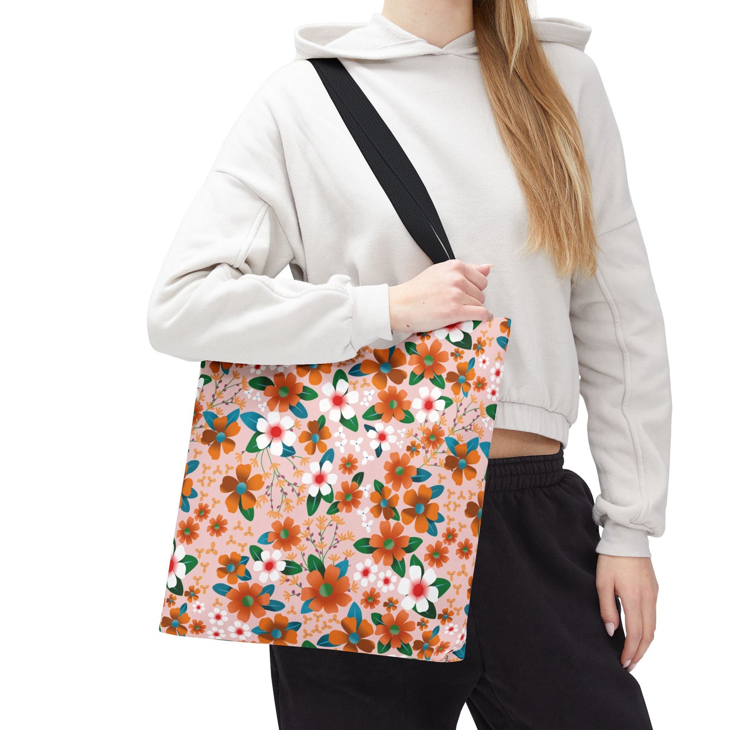 Peach Poppy Grove Tote Bag with vibrant floral pattern, ideal for summer outings, features durable polyester, reinforced black strap, and spacious boxed corners, embodying FireBrook Designs' joyful and stylish ethos.