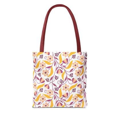 Floral Tote Bag with burgundy-red straps features a vibrant floral pattern with six-petaled flowers and tulip-shaped blossoms, ideal for summer outings and beach trips, embodying FireBrook Essentials' uplifting design ethos.
