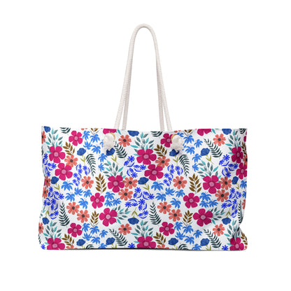 Weekender Bag with vibrant watercolor floral pattern and sturdy white rope handles, perfect for stylish travel. Spacious and summery, embodies FireBrook Essentials' blend of comfort and uplifting design.
