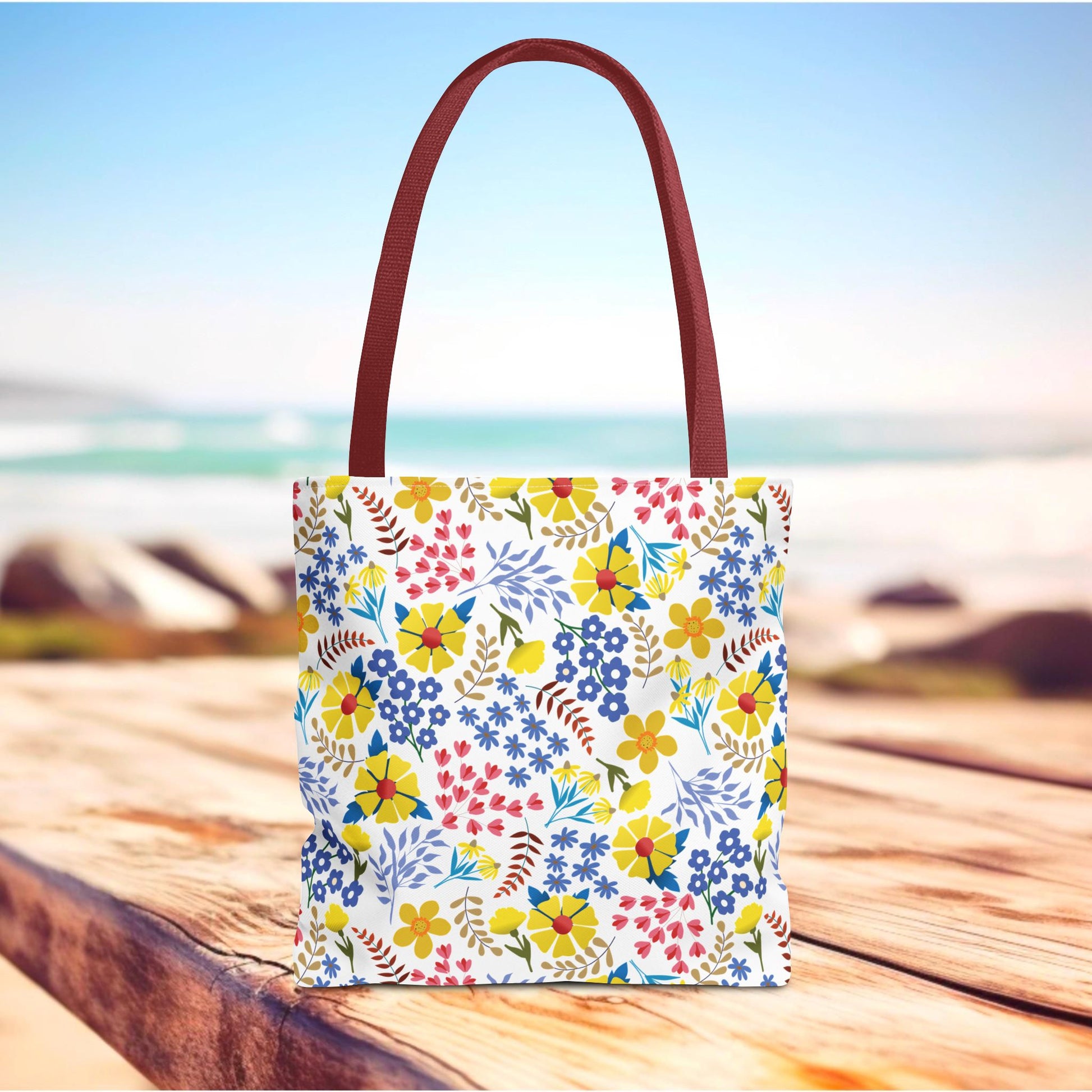 Floral Tote Bag with burgundy handles, featuring a vibrant all-over floral pattern on a white background, perfect for summer outings. Designed by FireBrook Essentials for style and joy.