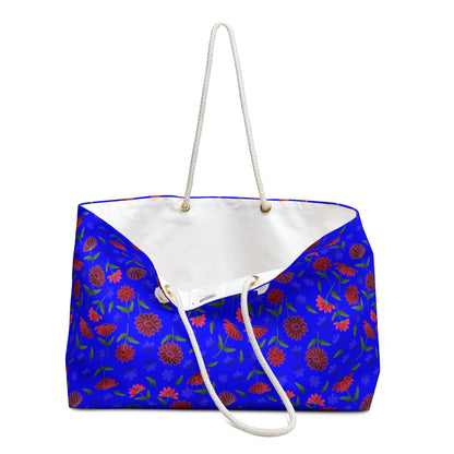 Floral Blue Weekender Bag — Bright Boho Travel Tote with rope handles and vibrant floral pattern, showcasing a spacious design perfect for joyful, stylish travels.