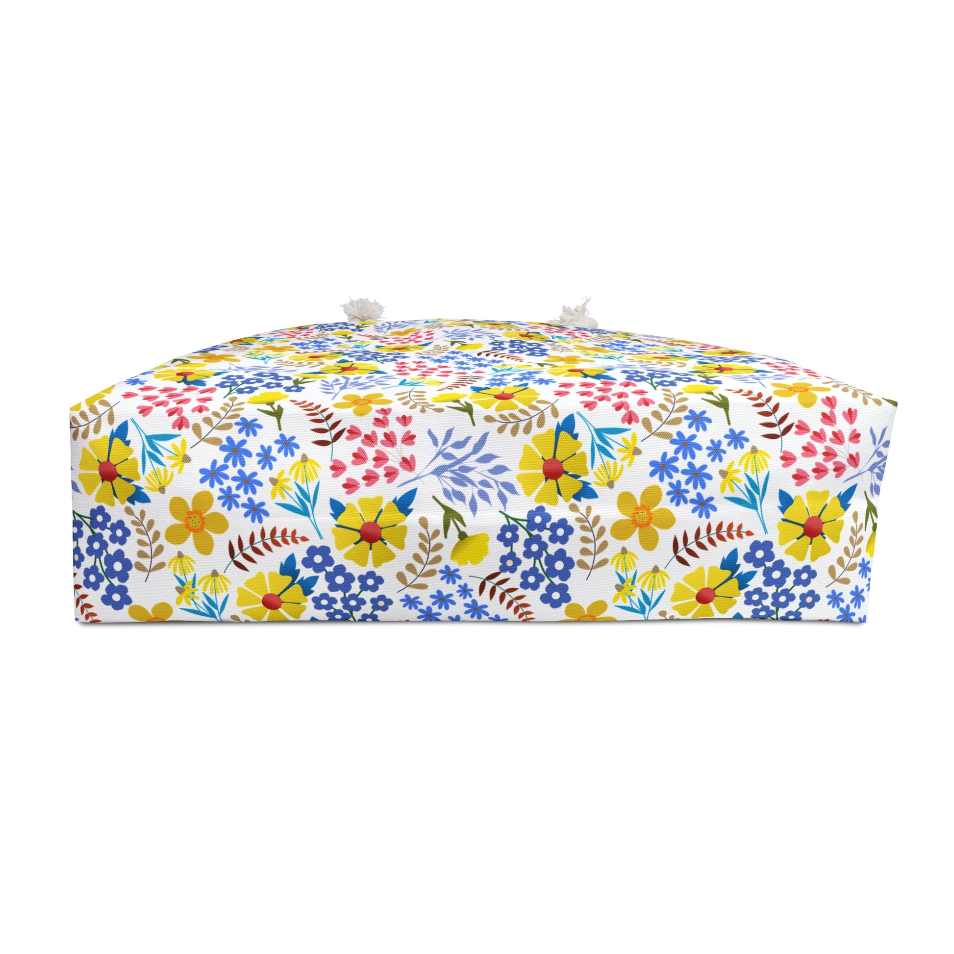 Weekender Bag with bright, multicolored floral pattern and fabric-loop handles, ideal for stylish travel. Designed by FireBrook Essentials to bring comfort and positivity to your journey.