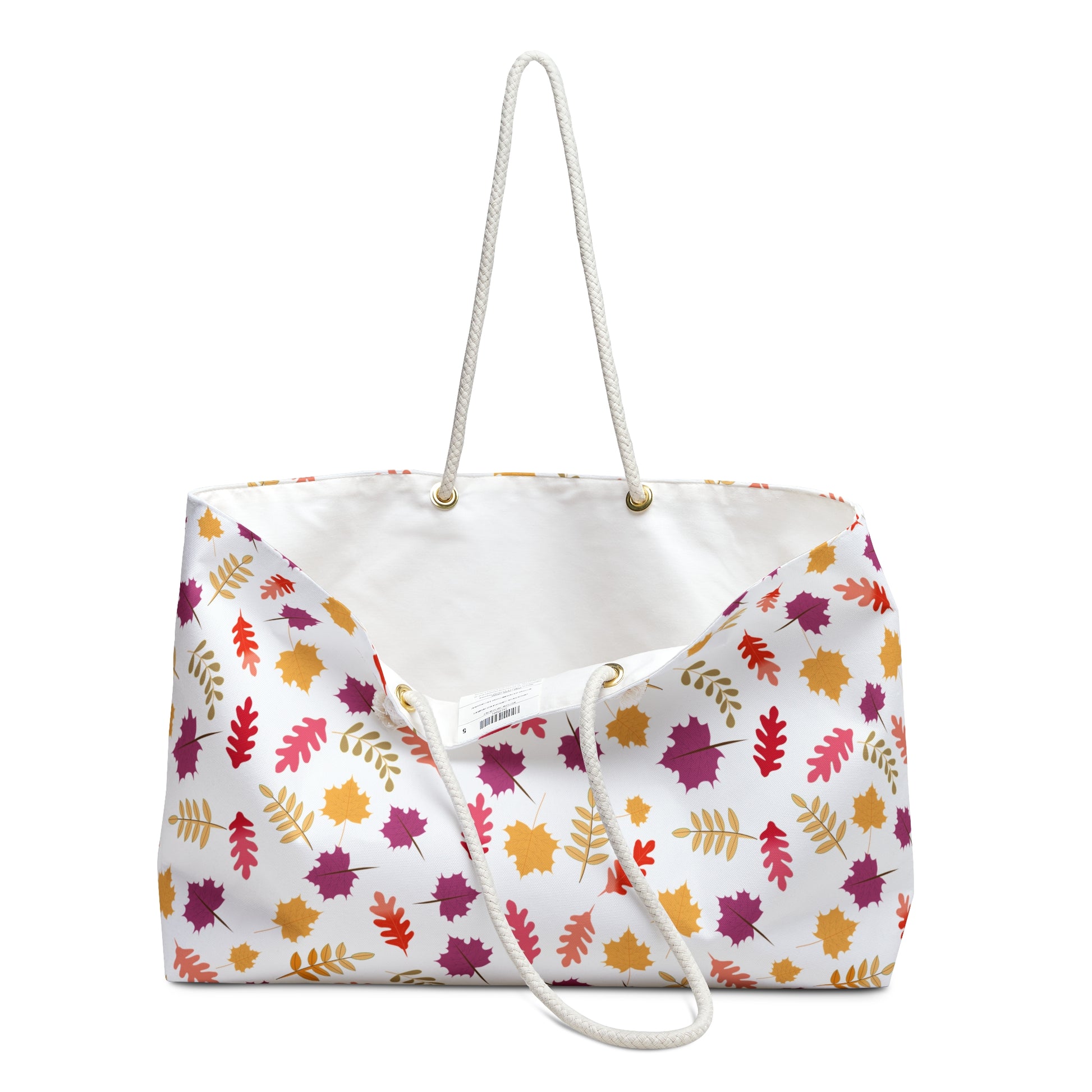Weekender Bag with soft rope handles, featuring a vibrant autumn leaf pattern on a white backdrop. Its spacious design and luxurious interior make it ideal for stylish, joyful travel.